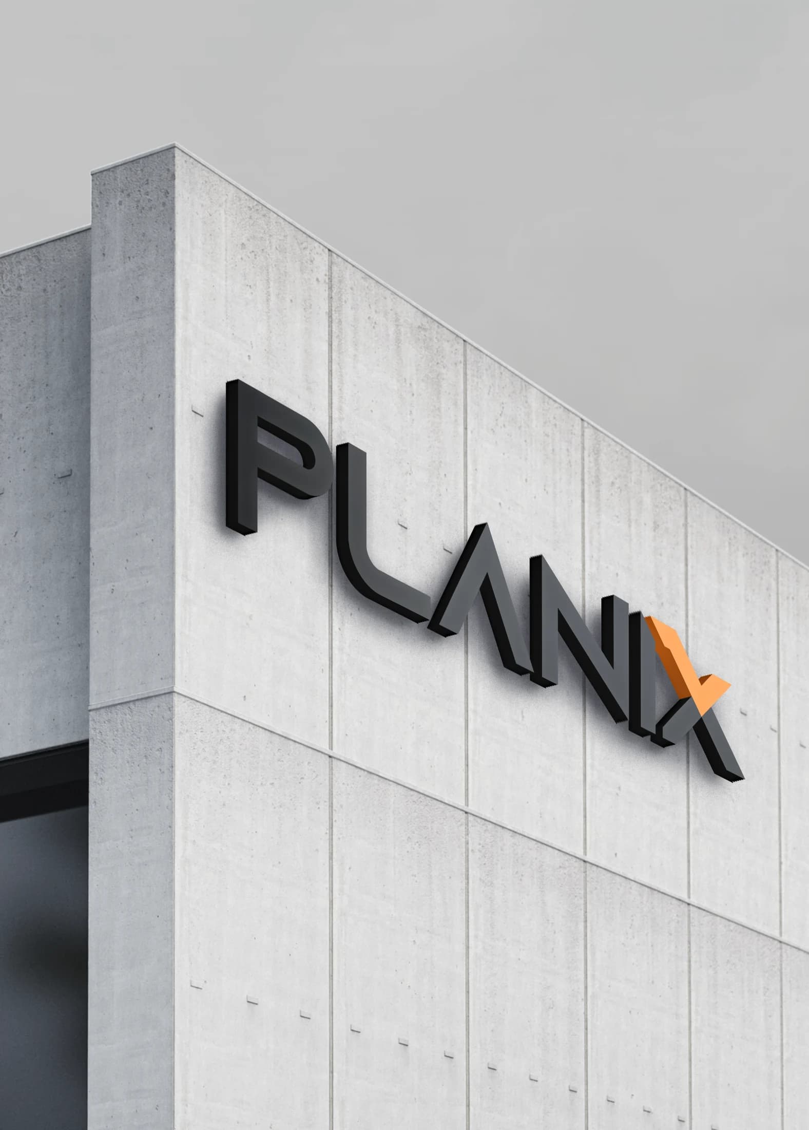 The Planix nameplate mounted on the concrete facade of an office building in Doha